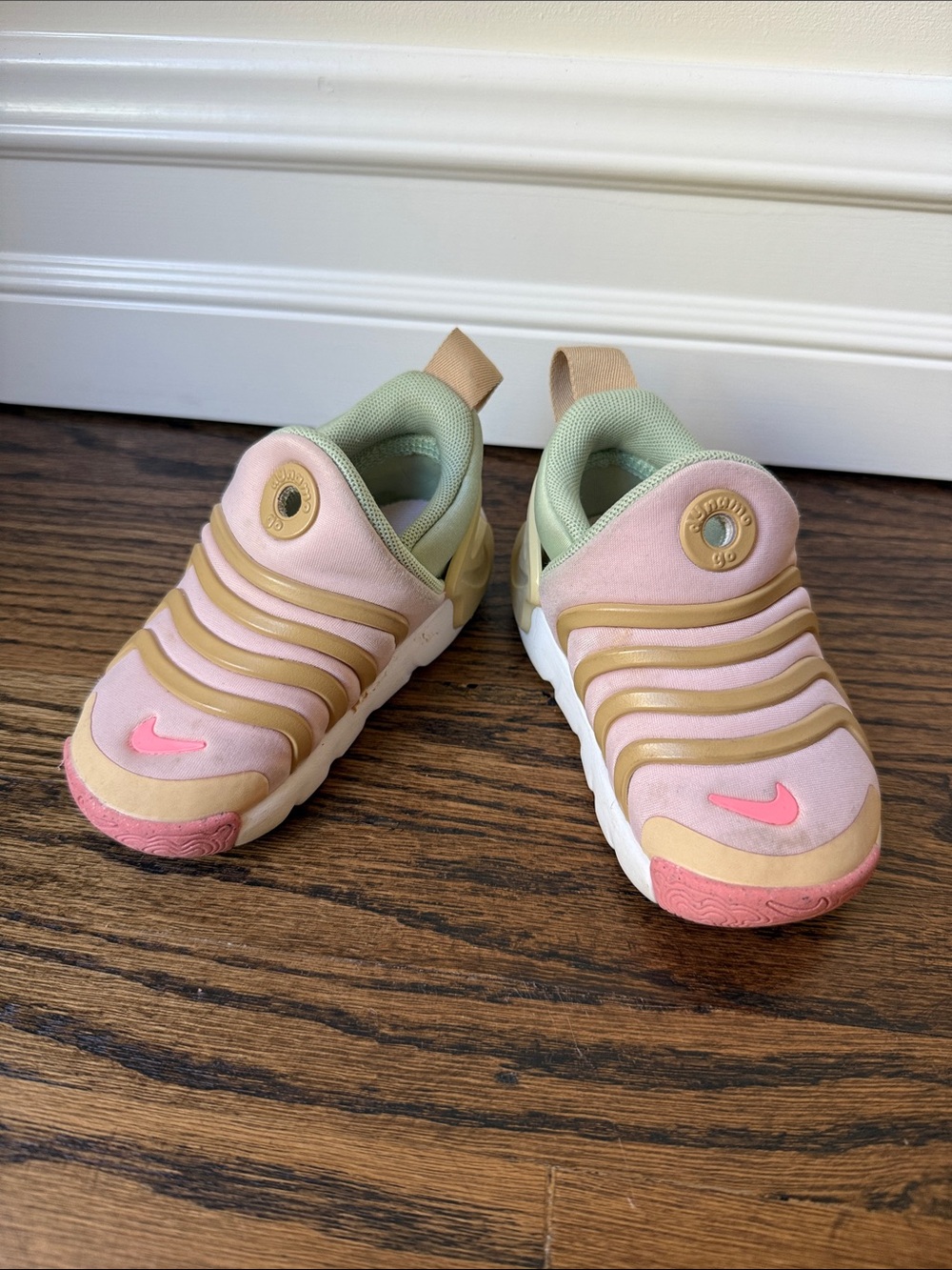 Pink and green Nike dynamo go